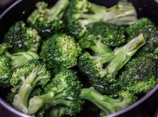 Cooking broccoli for its health benefits.
