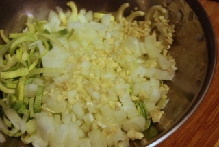 Chopped and thinly diced leek, onion and garlic are just about to be added to a cancer-fighting lentil soup.