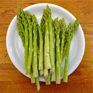 Asparagus stems in a plate, ready for dinner.