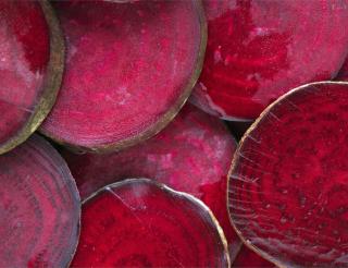 Benefits of red beet, whether sliced as in the image or cooked.