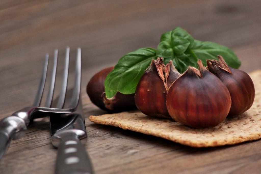 Chestnuts on a cracker with cutlery