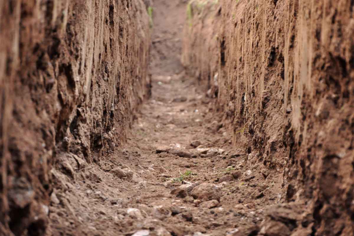 Trench dug in clay soil