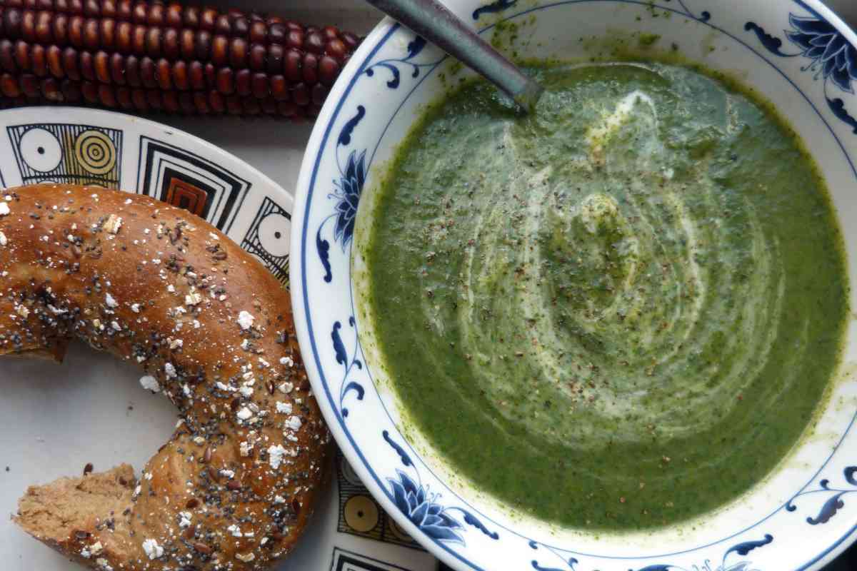 Bowl of nettle soup with a pretzel