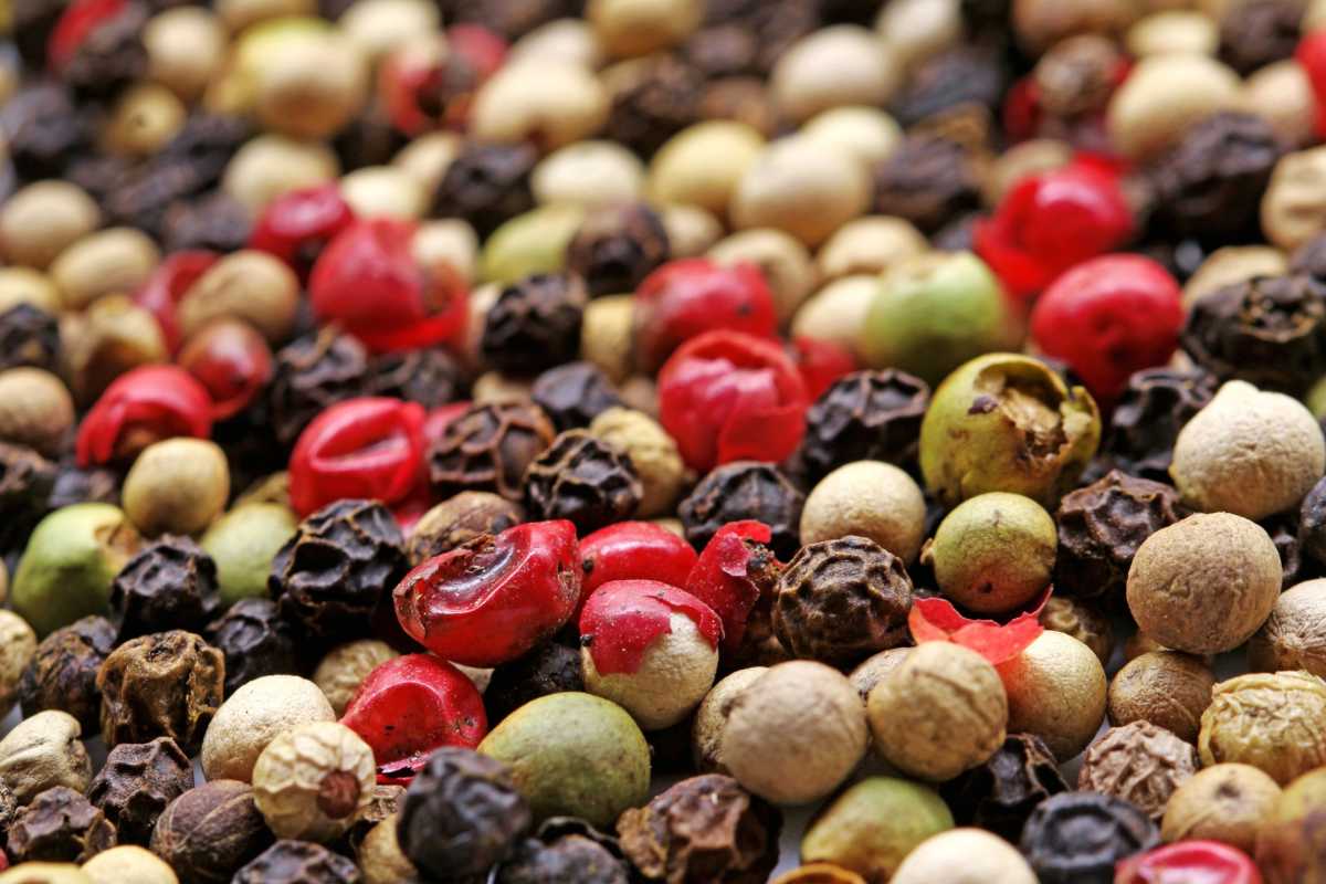 Different types of pepper kernels mixed and creating a landscape