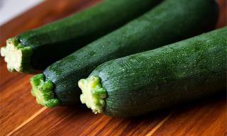 Zucchini on a varnished table.