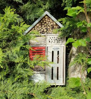 A deluxe insect hotel with holes, nooks and crannies for insects.