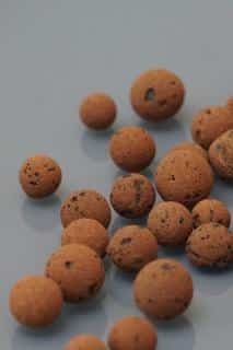 Expanded clay or leca balls on a glass surface