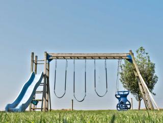 Wooden swingset with 5 activities.