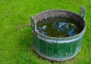 Wooden bucket used to prepare fermented weed tea in.