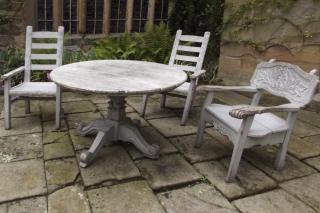 Color-matching old furniture looks great in a garden, for cheap, too.