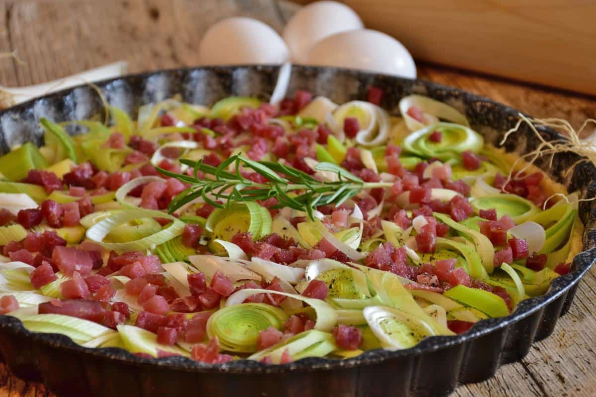 Leek and ham quiche in preparation