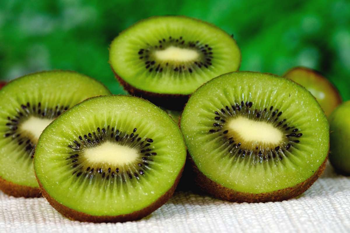 Kiwi sliced open and set upon a cloth