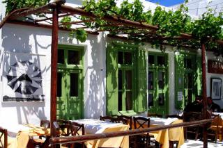 Restaurant with a vine that provides shade on a pergola