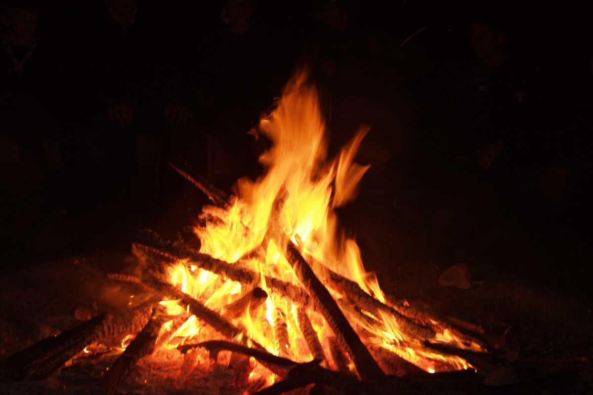 Bonfire at a campsite with the right type of logs and wood