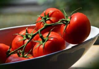Cluster tomatoes in a bowl, ready for a salad