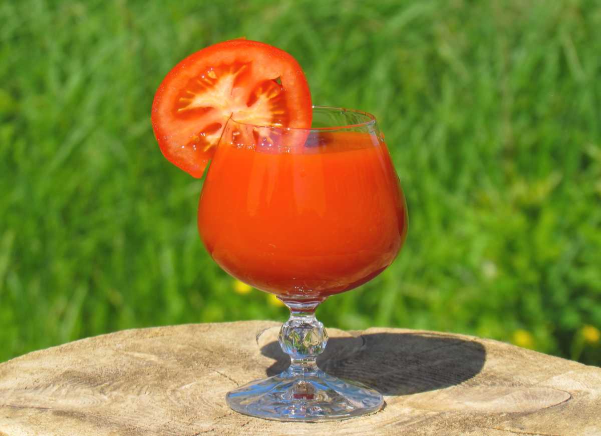 Refreshing summer drink with blended tomato and strawberry