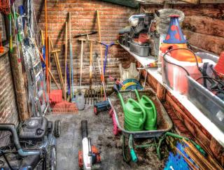 Many tools help speed work up in the garden, and storing them in a shed helps