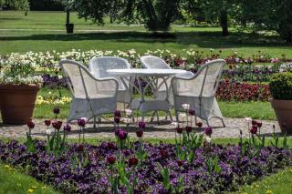 White resin furniture set in a garden setting